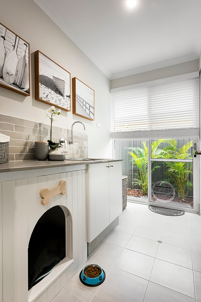 Design ideas for a beach style laundry room in Perth.