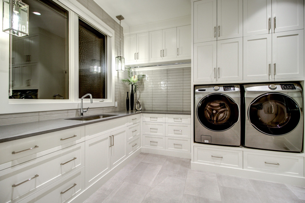 Transitional laundry room in Calgary.