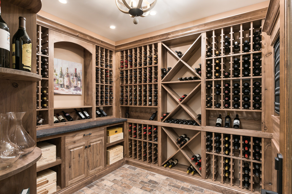 Design ideas for a large traditional wine cellar in Chicago with brick floors, storage racks and brown floor.