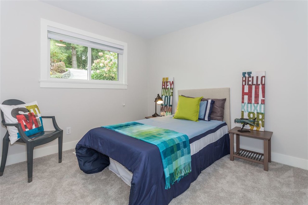 Small modern guest bedroom in Vancouver with grey walls and carpet.