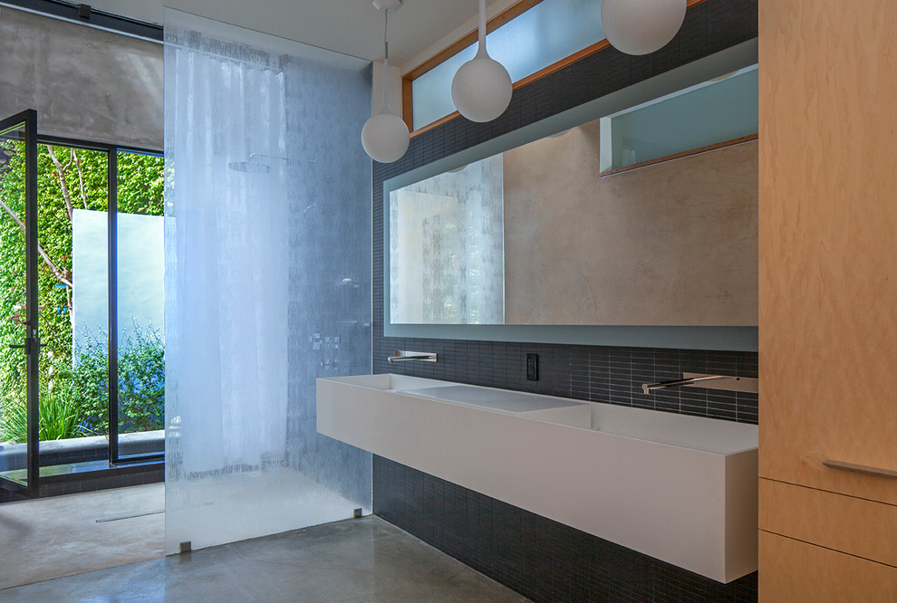 Photo of a large modern master bathroom in Los Angeles with gray tile, porcelain tile, grey walls, concrete floors, grey floor, an open shower, a curbless shower, flat-panel cabinets, white cabinets, an integrated sink and white benchtops.