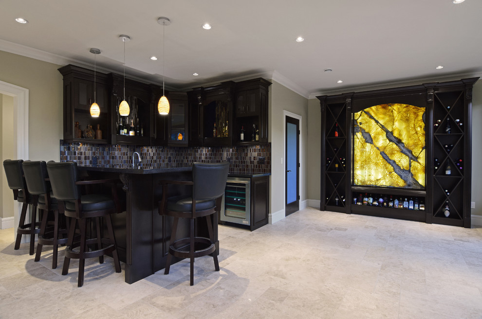 Design ideas for a traditional home bar in Vancouver with an undermount sink, dark wood cabinets, granite benchtops, glass tile splashback and limestone floors.