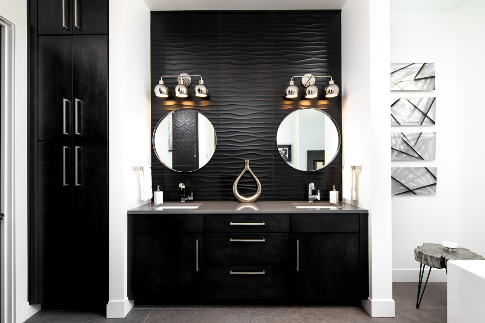 Inspiration for a modern black tile double-sink bathroom remodel in Portland with flat-panel cabinets, black cabinets, an undermount sink, quartzite countertops, gray countertops and a built-in vanity