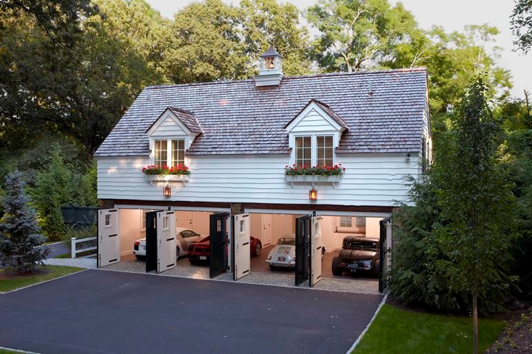 Photo of a mid-sized traditional detached four-car garage in Boston.