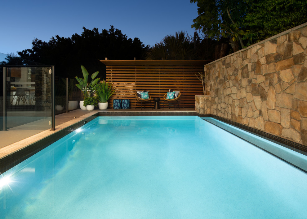 Design ideas for a mid-sized modern pool in Brisbane.
