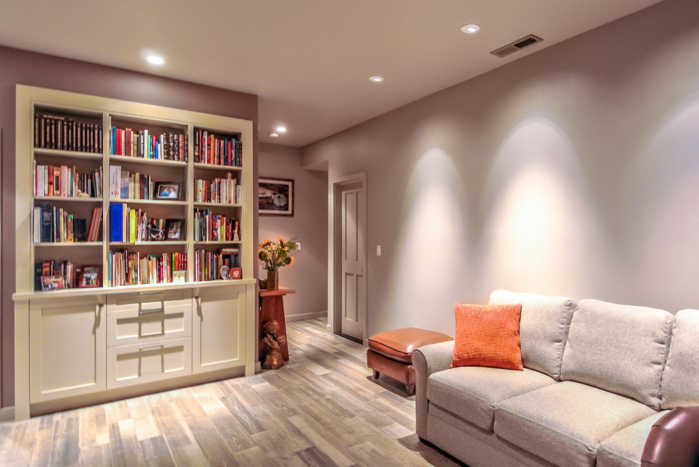 Photo of a mid-sized contemporary home office in San Francisco with a library, grey walls, ceramic floors, a corner fireplace and a stone fireplace surround.