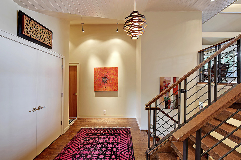 Inspiration for a mid-sized contemporary wood u-shaped staircase in Seattle with open risers.