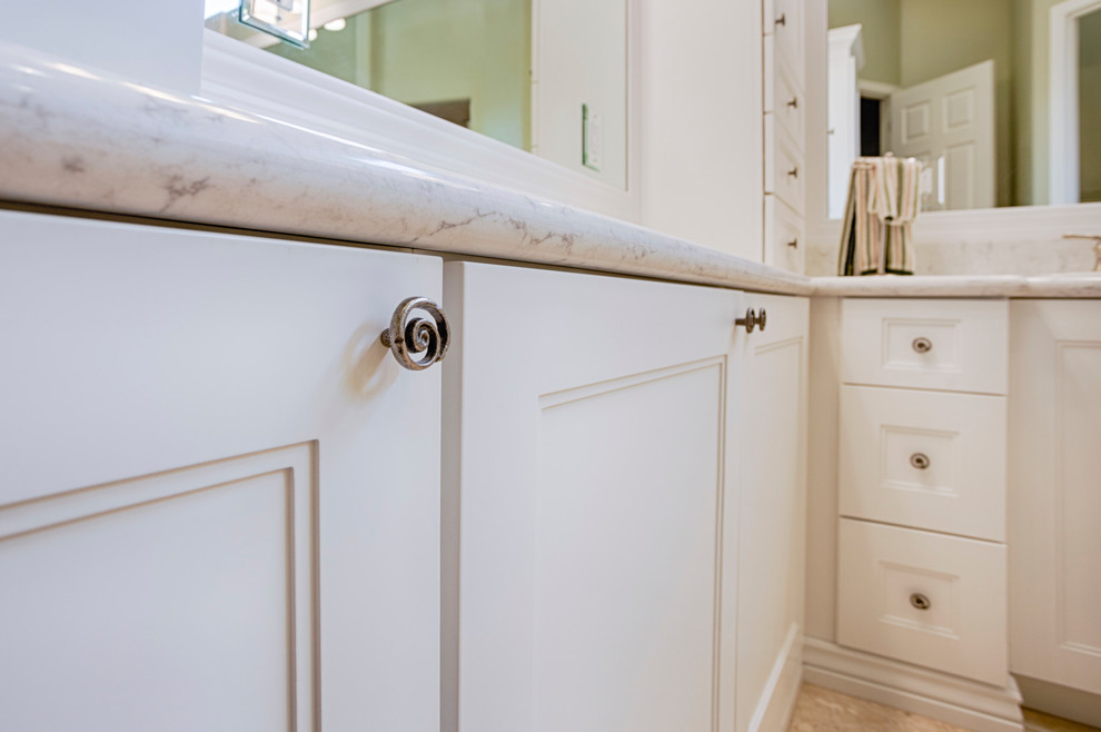 Large transitional master beige tile and travertine tile travertine floor corner shower photo in Phoenix with recessed-panel cabinets, white cabinets, green walls, an undermount sink and granite countertops