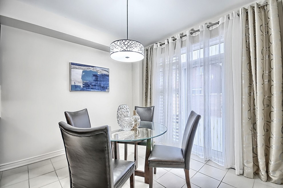 Example of a mid-sized transitional l-shaped ceramic tile and beige floor open concept kitchen design in Toronto with an undermount sink, shaker cabinets, gray cabinets, granite countertops, beige backsplash, mosaic tile backsplash, stainless steel appliances and an island