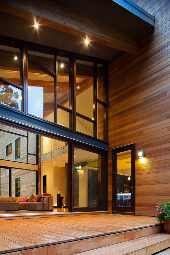 Inspiration for a contemporary exterior in Grand Rapids with wood siding.