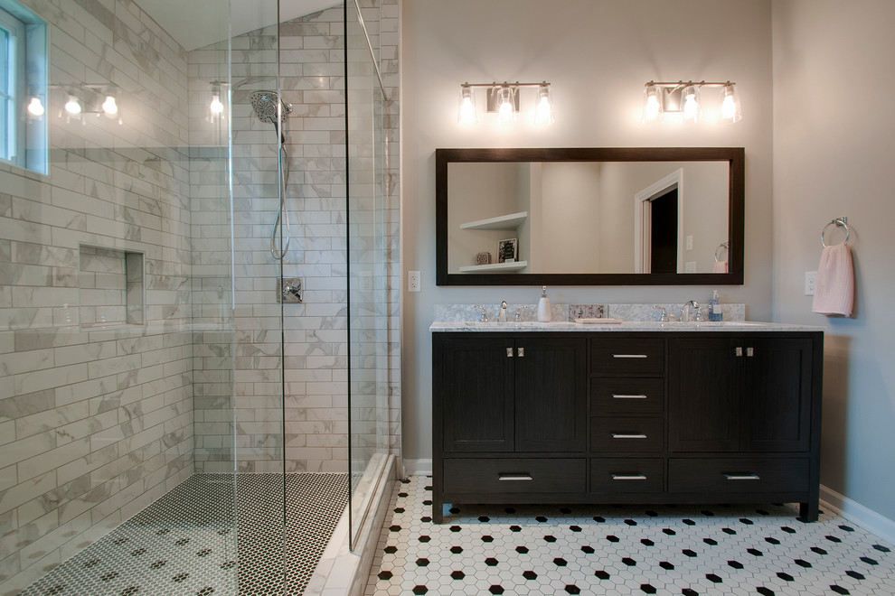Inspiration for a mid-sized transitional master bathroom in Nashville with shaker cabinets, black cabinets, a one-piece toilet, black and white tile, marble, grey walls, ceramic floors, an undermount sink, marble benchtops, multi-coloured floor, white benchtops and an alcove shower.