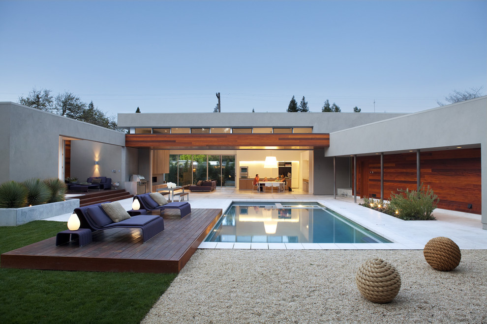 Modern courtyard pool in San Francisco with decking.