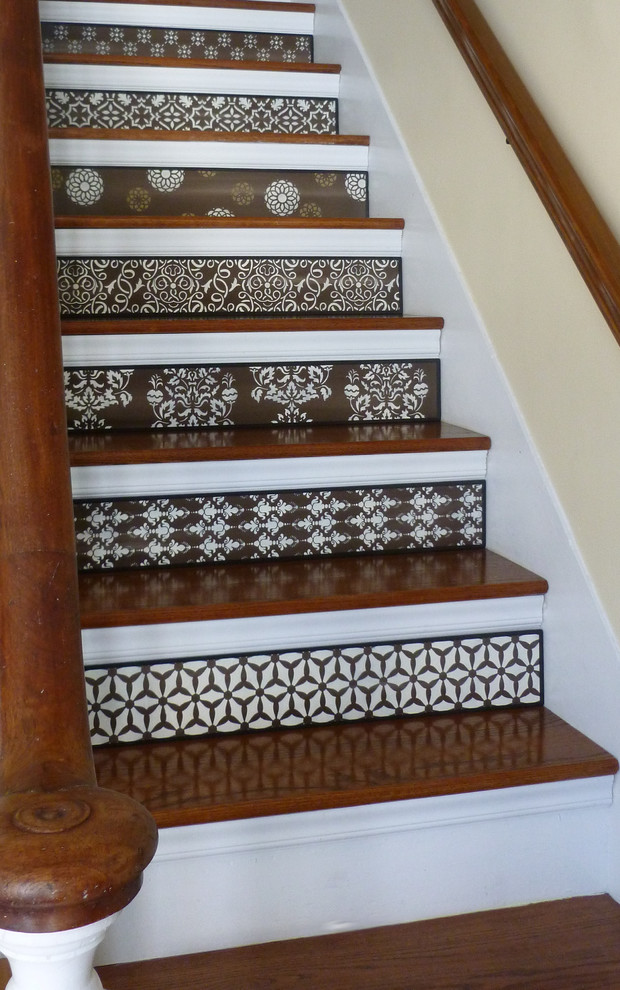 Design ideas for a mid-sized transitional wood straight staircase in Boston with painted wood risers.