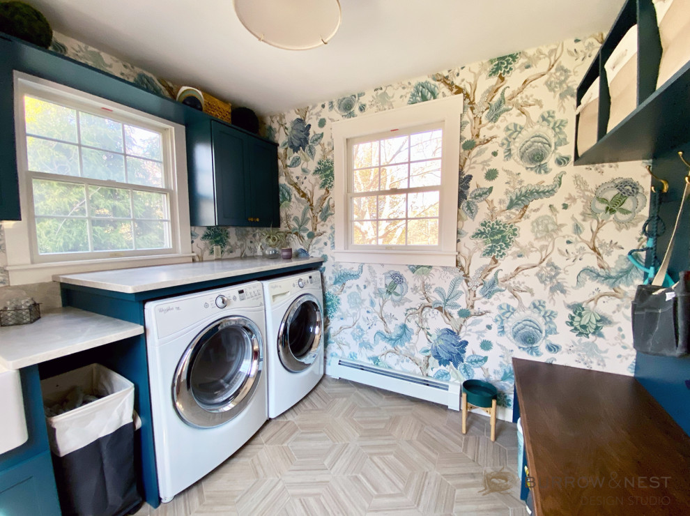 Example of a country wallpaper utility room design in Providence with a farmhouse sink, turquoise cabinets, quartzite countertops, a side-by-side washer/dryer and beige countertops