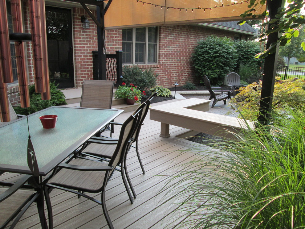 Inspiration for a small transitional backyard deck remodel
