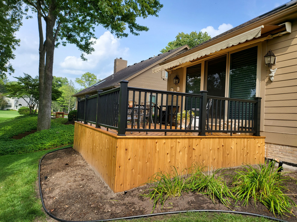 Mid-sized backyard deck photo