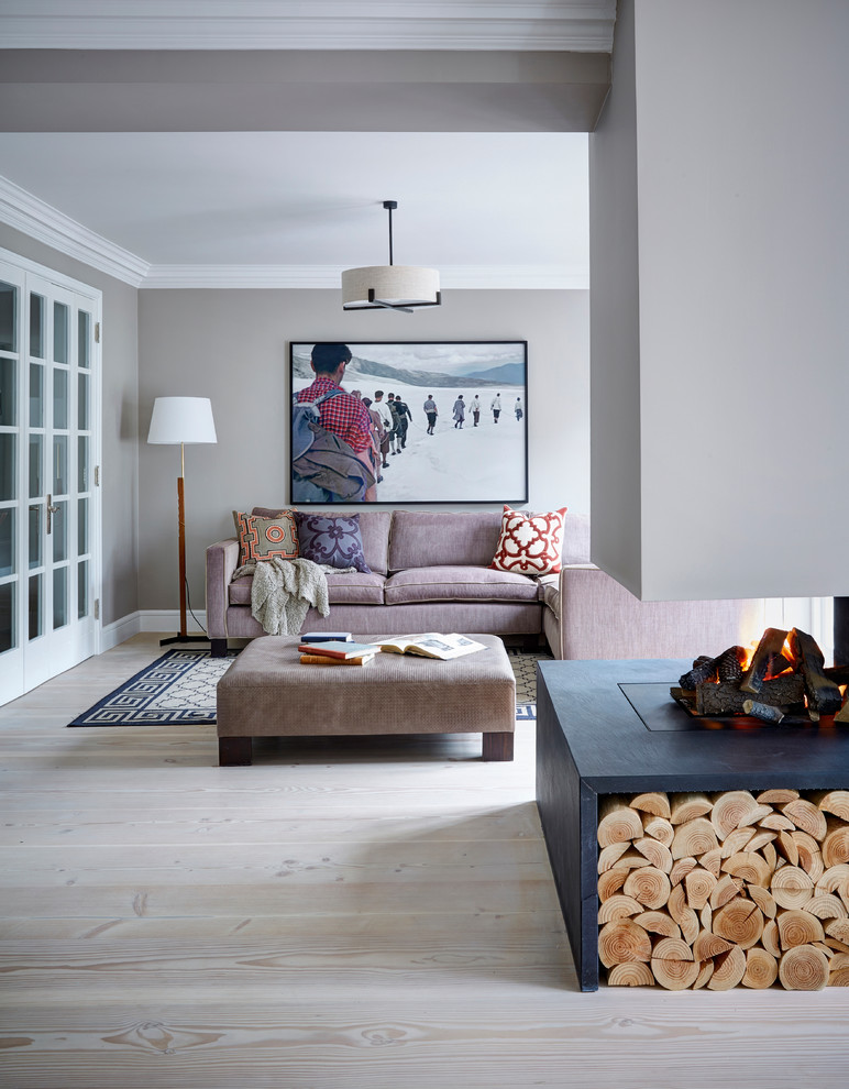 Contemporary living room in London with light hardwood floors.