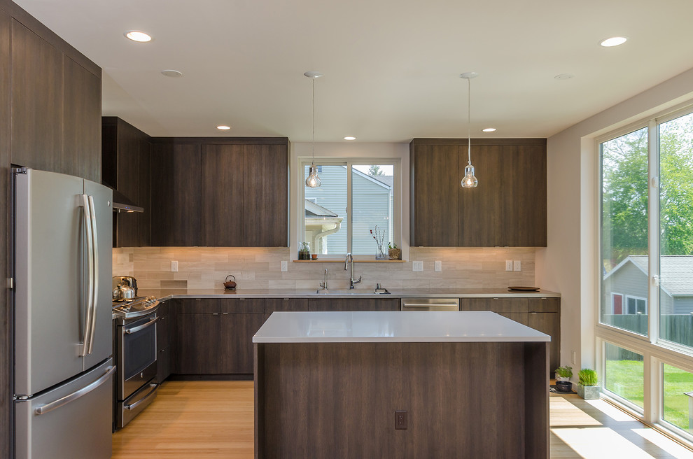 Inspiration for a mid-sized modern l-shaped open plan kitchen in Seattle with flat-panel cabinets, dark wood cabinets, quartz benchtops, beige splashback, porcelain splashback, stainless steel appliances, bamboo floors and with island.