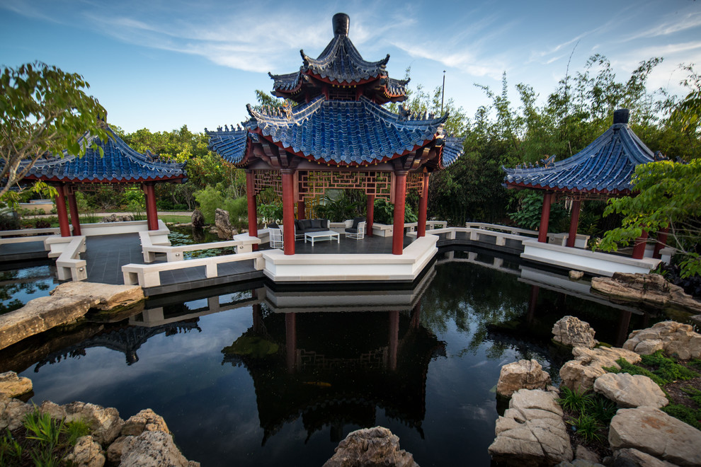 Design ideas for an asian garden in Tampa with a water feature.