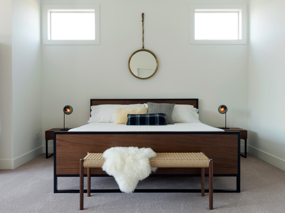 Design ideas for a contemporary master bedroom in Portland with white walls and carpet.