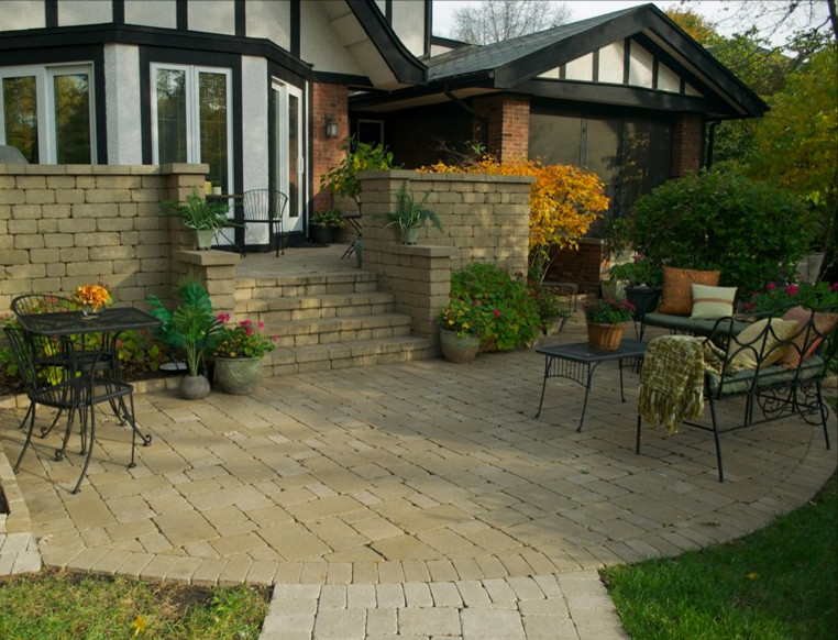 Mid-sized transitional backyard brick patio photo in Chicago
