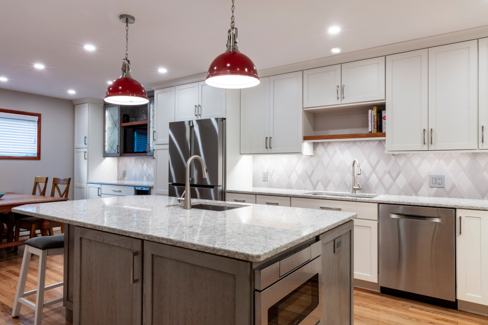 Transitional kitchen photo with shaker cabinets, quartz countertops and stainless steel appliances