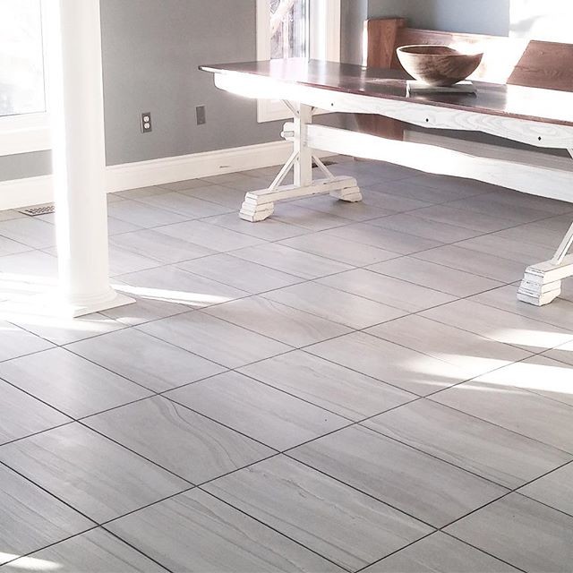 Inspiration for a large transitional porcelain tile and gray floor eat-in kitchen remodel in Toronto