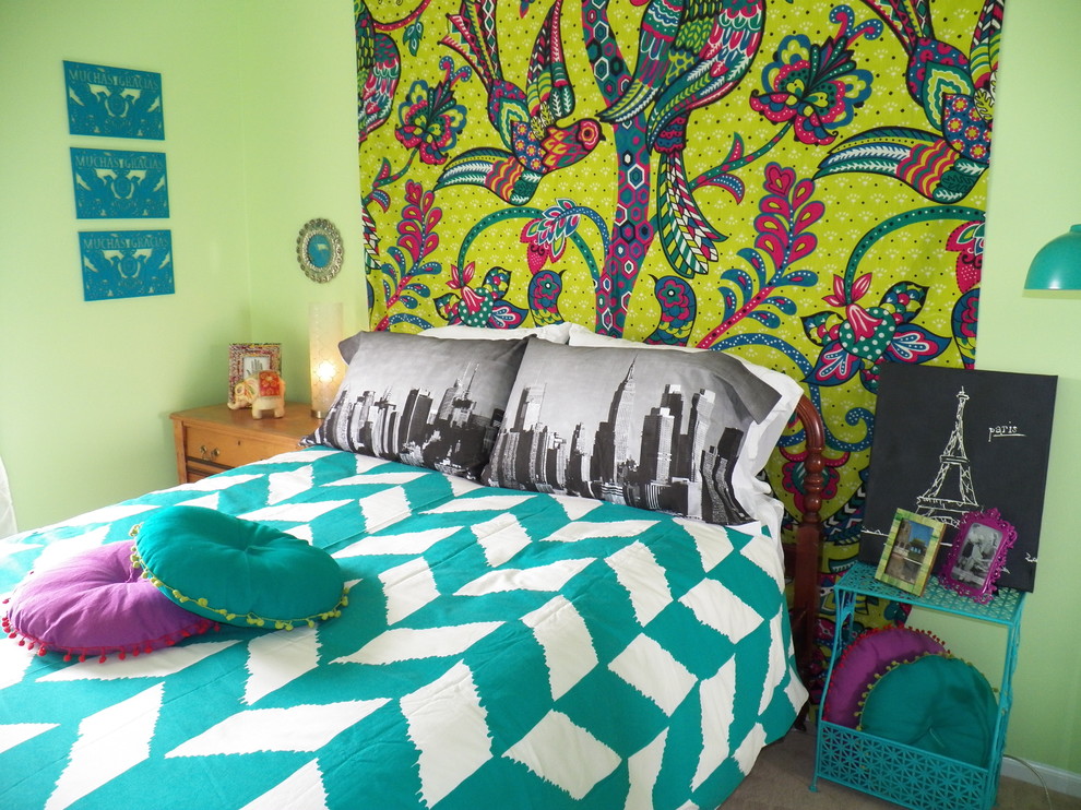 Photo of an eclectic kids' room for girls in Chicago with green walls.