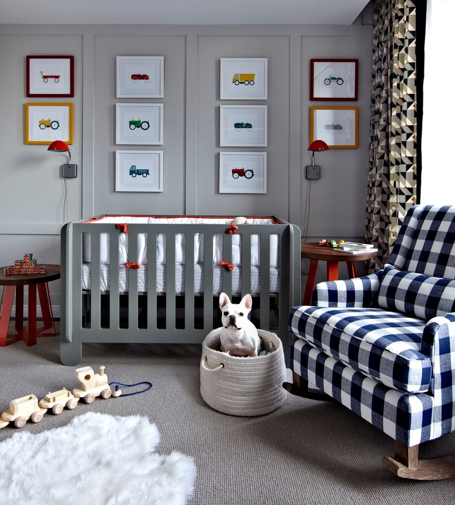 Photo of a mid-sized transitional nursery for boys in New York with grey walls and dark hardwood floors.