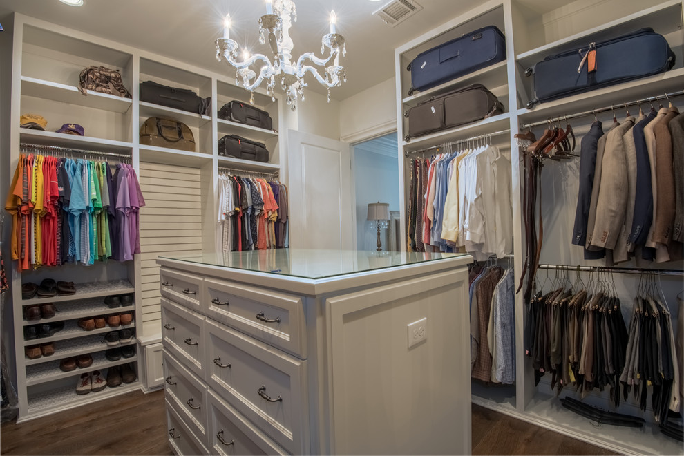 Large transitional women's dressing room in Houston with recessed-panel cabinets, white cabinets, dark hardwood floors and brown floor.