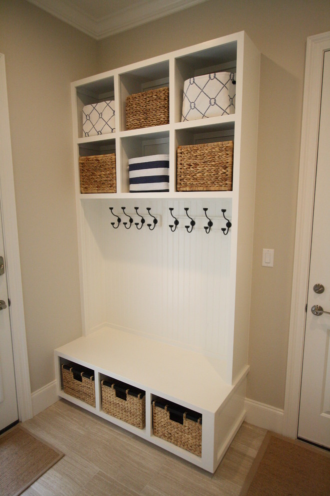 Photo of a small mediterranean mudroom in Miami with beige walls.