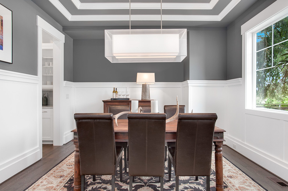Design ideas for a mid-sized transitional separate dining room in Seattle with grey walls and medium hardwood floors.