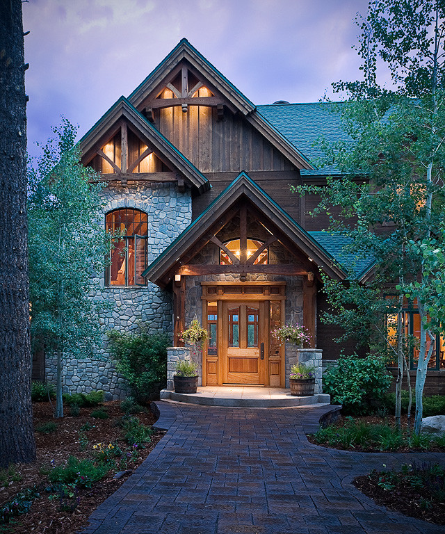 Inspiration for a large country three-storey exterior in Albuquerque with mixed siding.