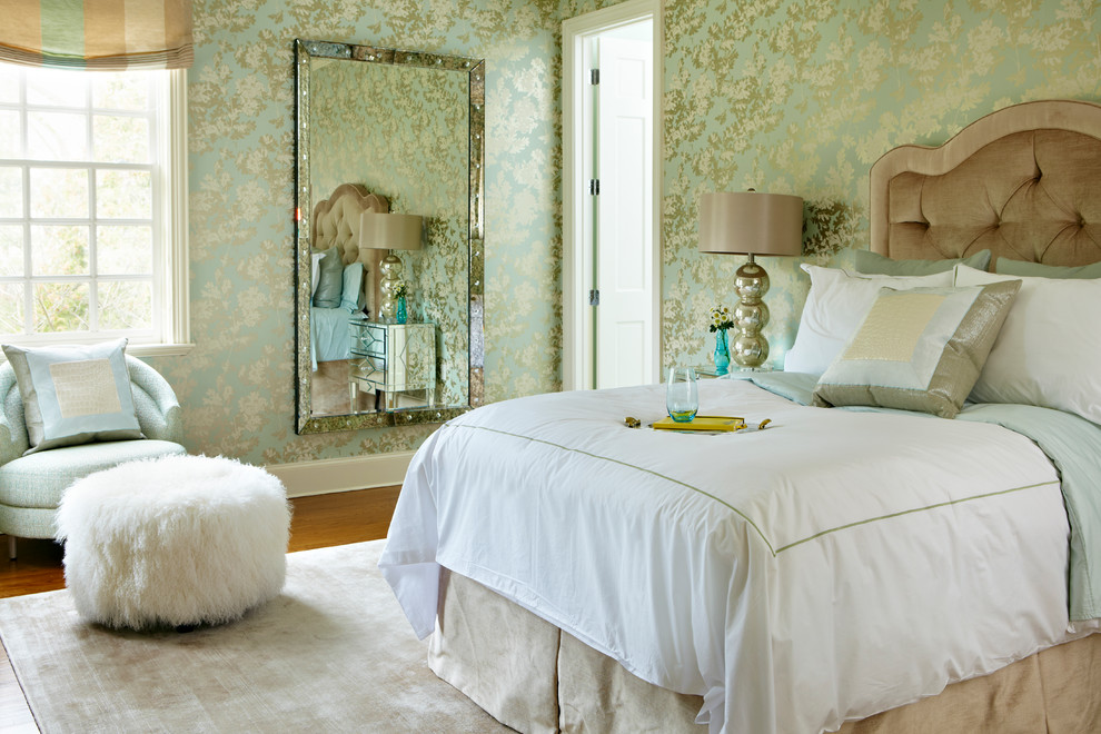 Example of a large transitional master medium tone wood floor bedroom design in New York with multicolored walls