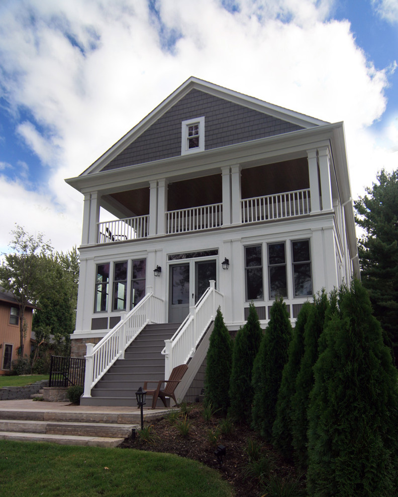 Photo of a traditional two-storey exterior in Detroit with wood siding.