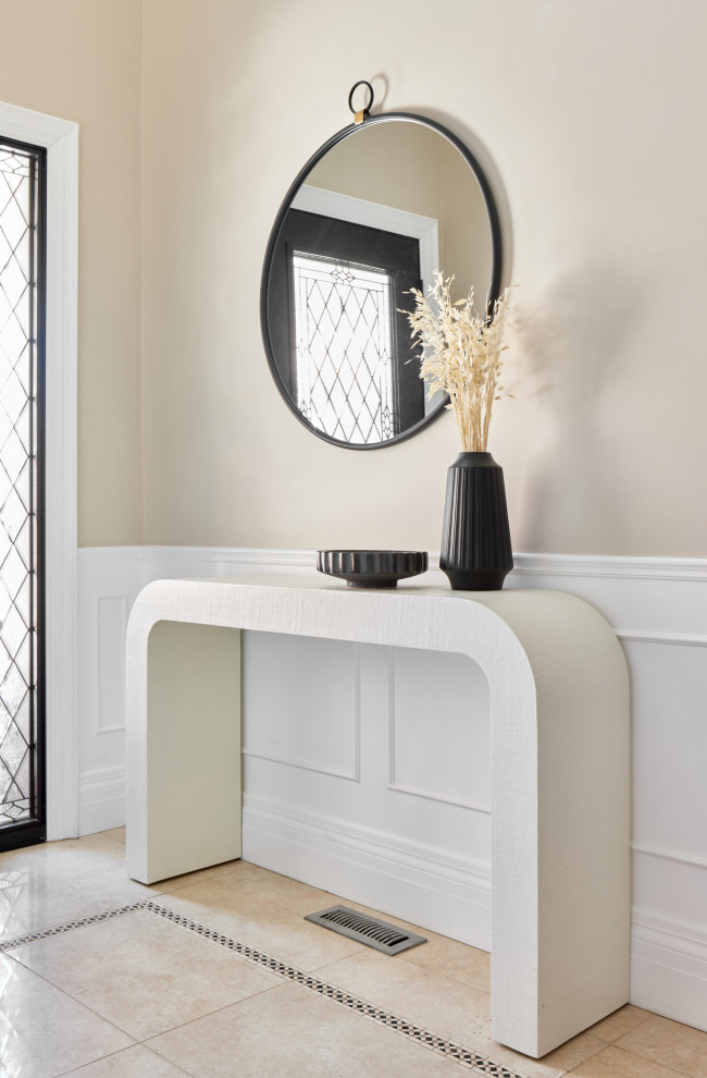 Entryway - transitional marble floor and wainscoting entryway idea in Toronto