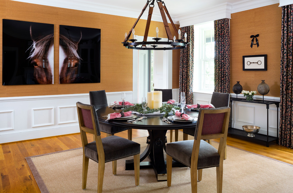 This is an example of a large country separate dining room in DC Metro with medium hardwood floors, no fireplace and yellow walls.