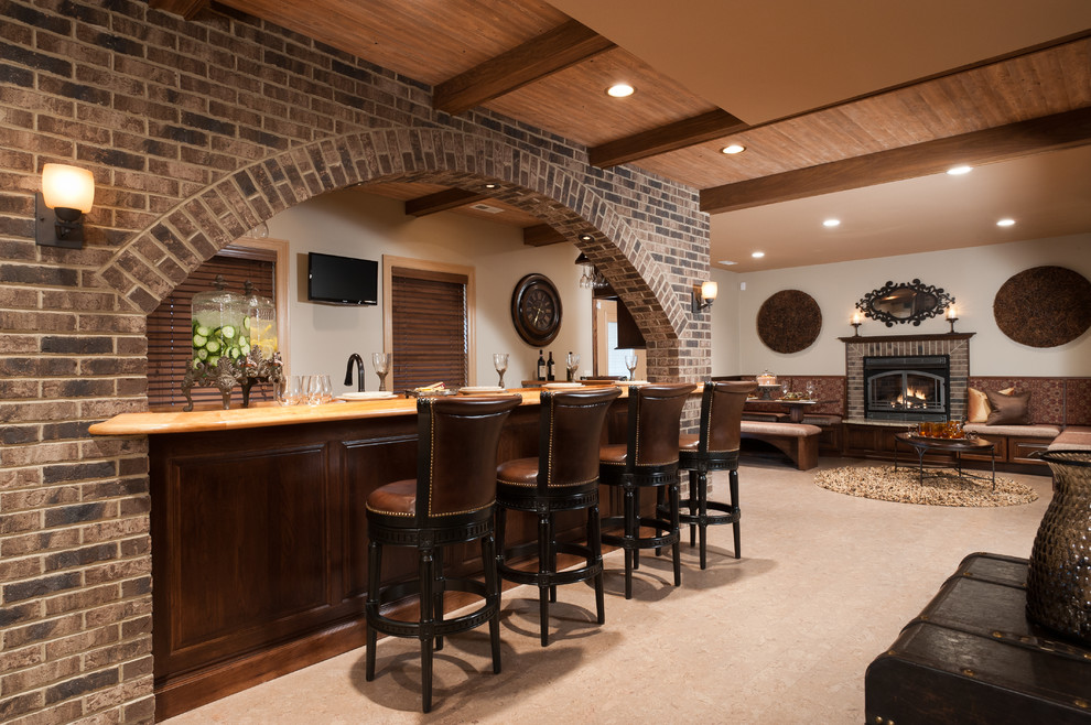 Photo of a large traditional home bar in Miami with ceramic floors and beige floor.