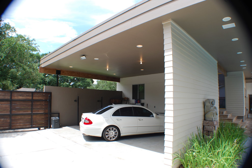 Photo of a midcentury two-car garage in Houston.