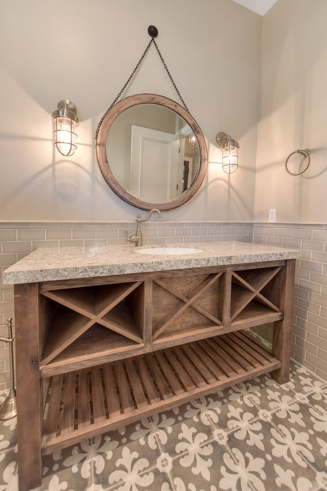 Inspiration for a large transitional 3/4 bathroom in Sacramento with open cabinets, medium wood cabinets, beige tile, subway tile, beige walls, cement tiles, an undermount sink, granite benchtops, grey floor and beige benchtops.