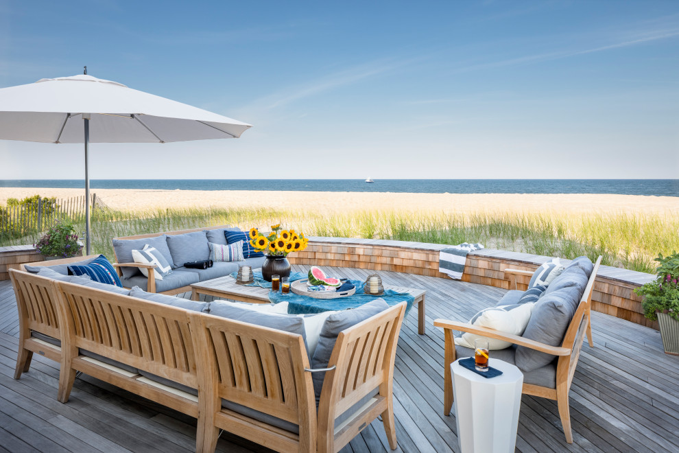 This is an example of a beach style deck in New York with no cover.