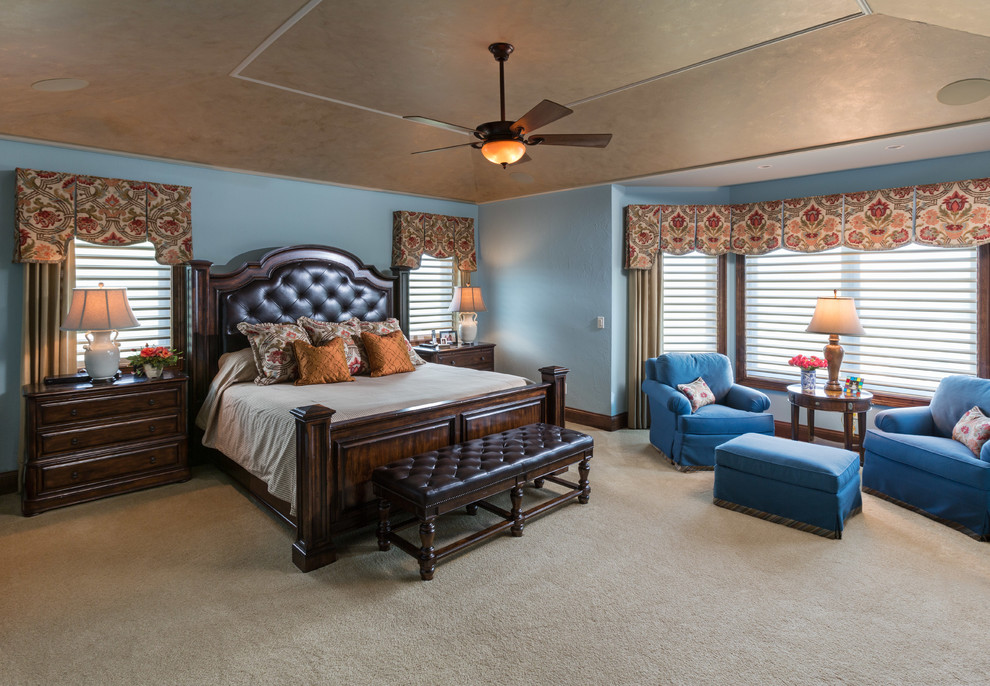 Photo of a traditional bedroom in Milwaukee with blue walls and carpet.