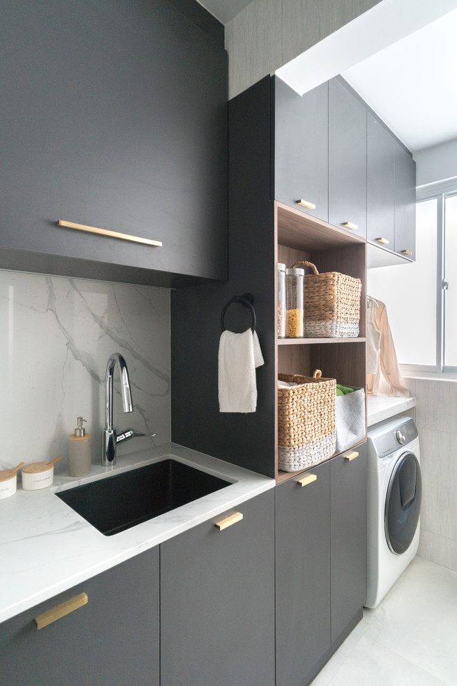 Contemporary utility room in Singapore with an undermount sink, flat-panel cabinets, grey cabinets, white walls, white floor and white benchtop.
