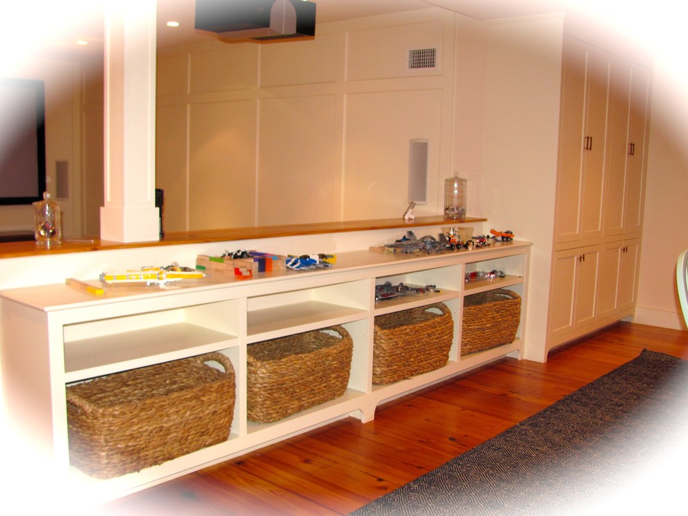 This is an example of a beach style basement in Boston.