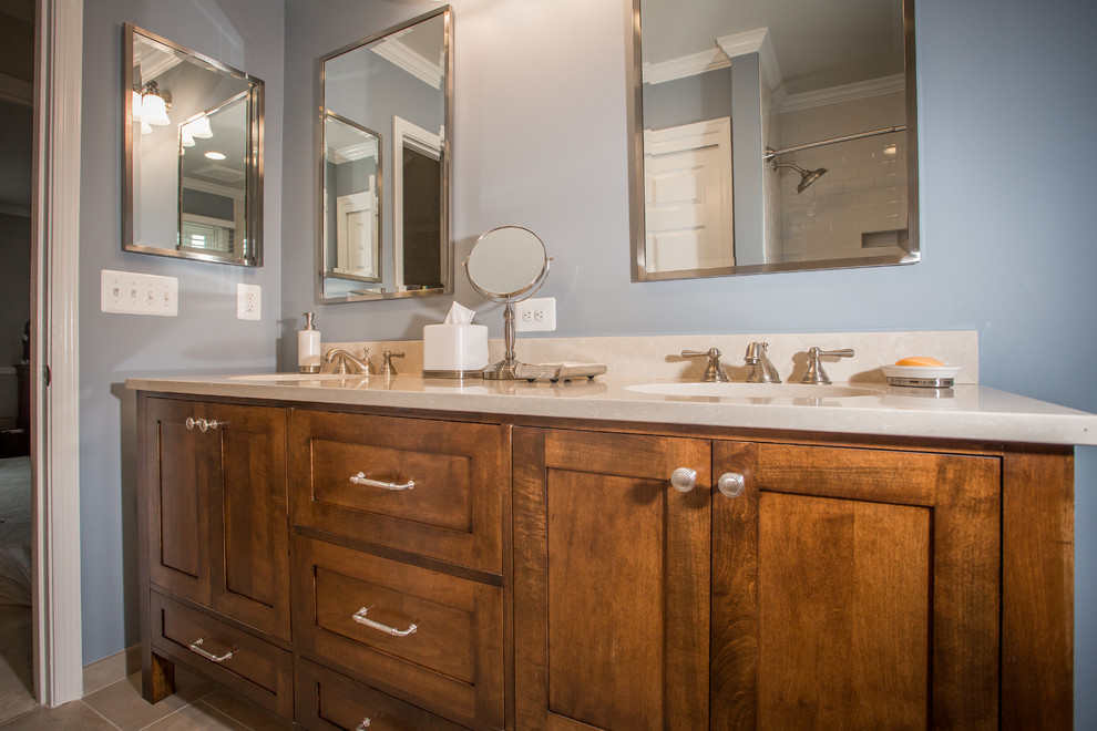 Alcove bathtub - mid-sized transitional beige tile and porcelain tile porcelain tile alcove bathtub idea in DC Metro with an undermount sink, flat-panel cabinets, dark wood cabinets, quartz countertops, a two-piece toilet and blue walls