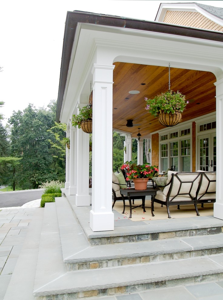 Traditional verandah in New York with a roof extension.