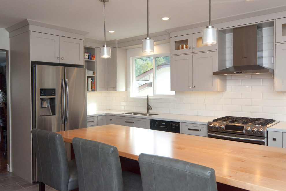 Example of a transitional kitchen design in Vancouver