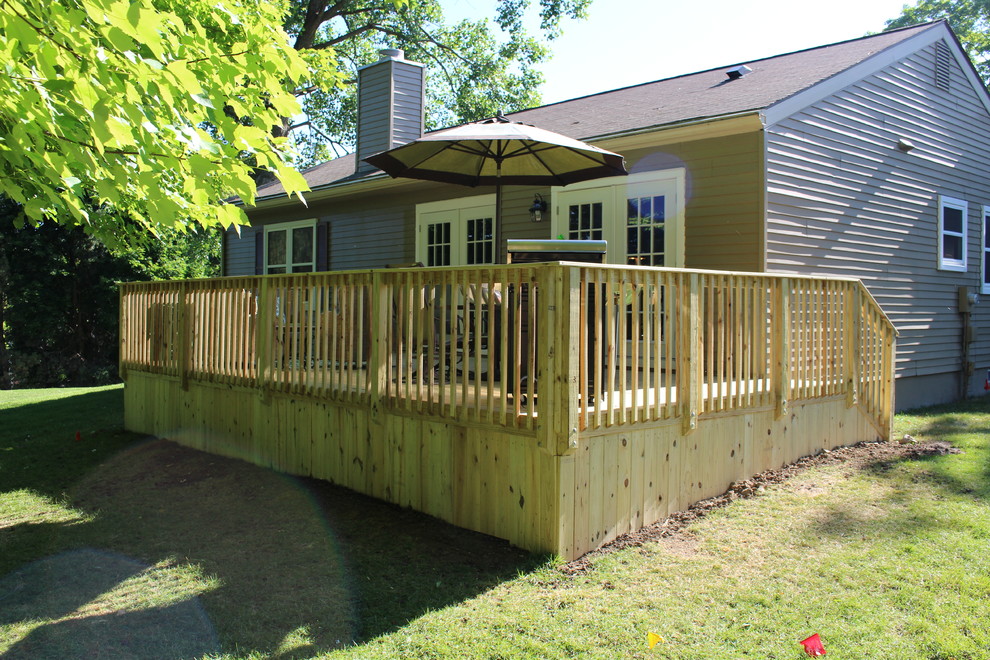 Small transitional backyard deck photo in Detroit with no cover