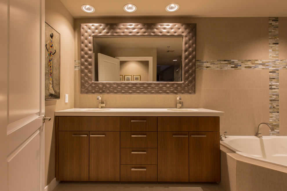 Example of a large transitional master beige tile and porcelain tile porcelain tile and beige floor corner shower design in Phoenix with flat-panel cabinets, medium tone wood cabinets, a hot tub, beige walls, an undermount sink, quartz countertops and a hinged shower door