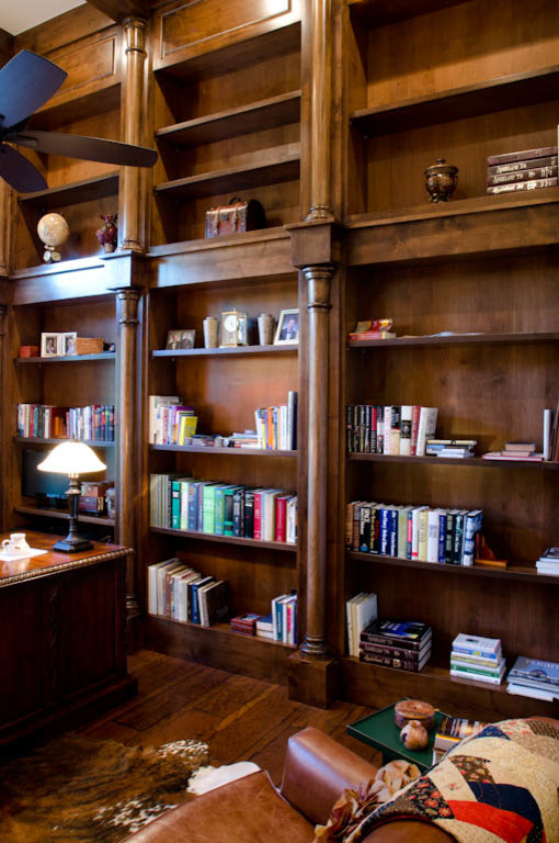 Photo of an expansive traditional study room in Austin with white walls, light hardwood floors and a freestanding desk.
